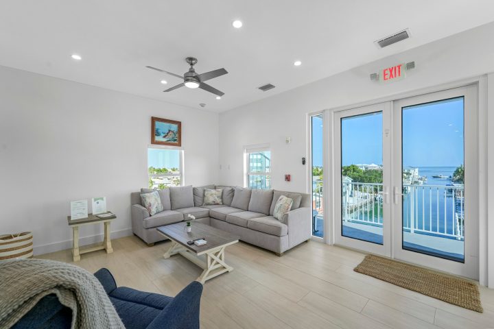 a living room filled with furniture and a large window