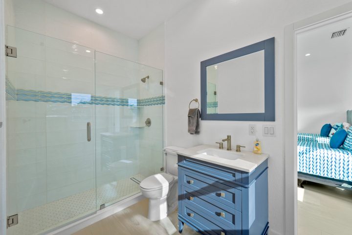 a room with a sink and a mirror