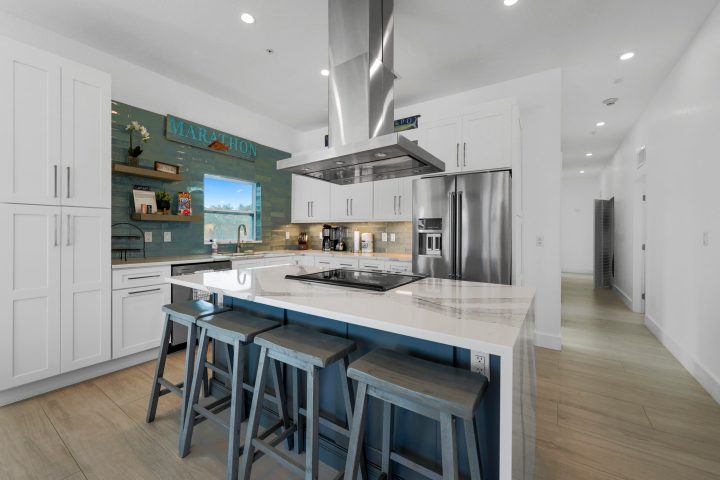 a large kitchen with stainless steel appliances
