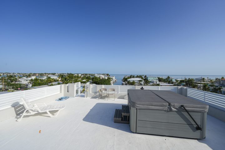 a man doing a trick on a skate board in the snow