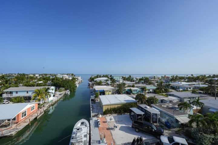 a large body of water with a city in the background