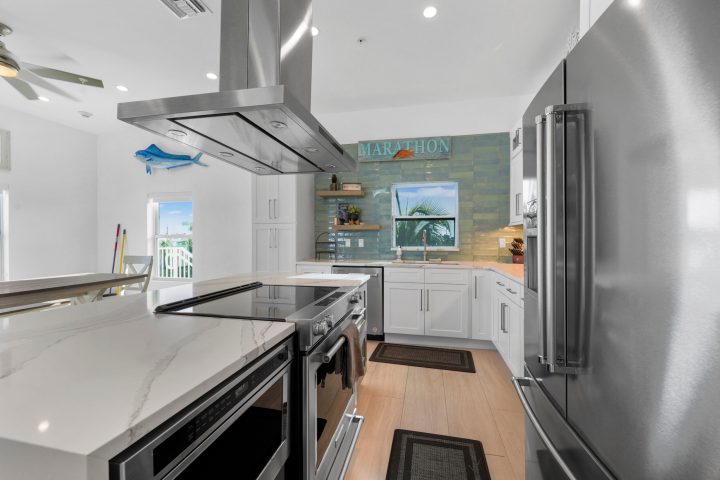 a large kitchen with stainless steel appliances